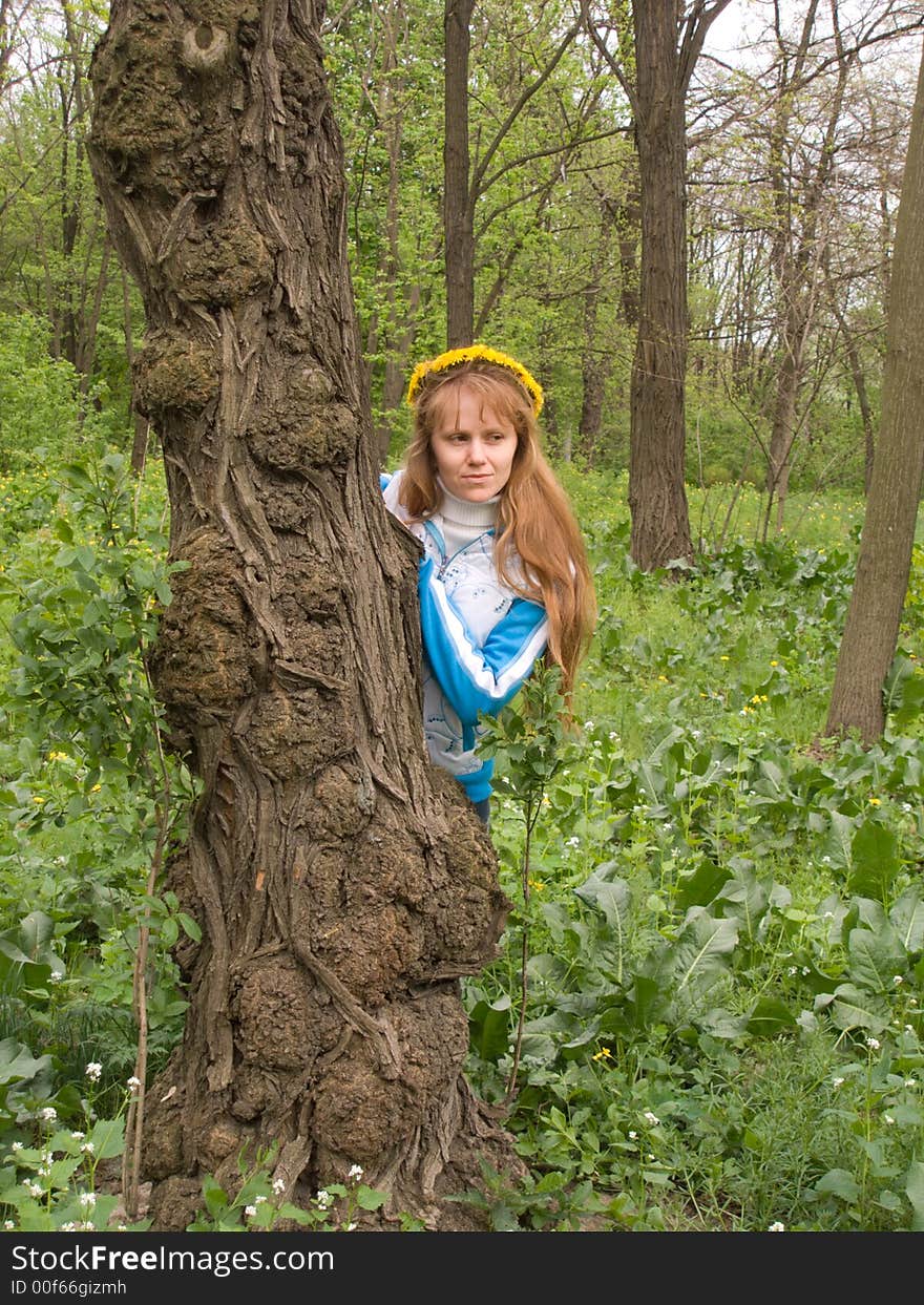 The red girl stands up for an old tree. The red girl stands up for an old tree