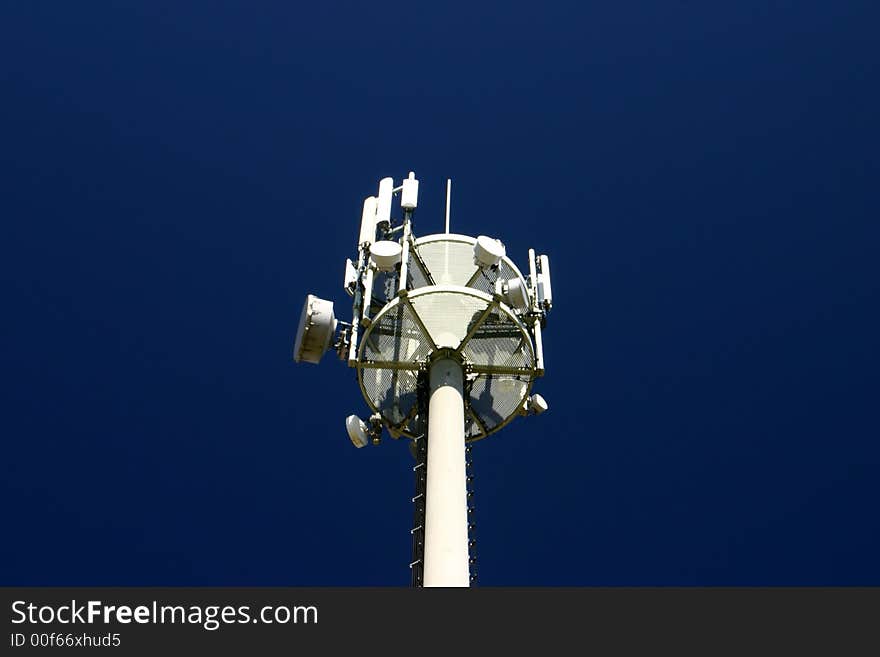 View at top of a aerial tower on a dark blue sky background. View at top of a aerial tower on a dark blue sky background