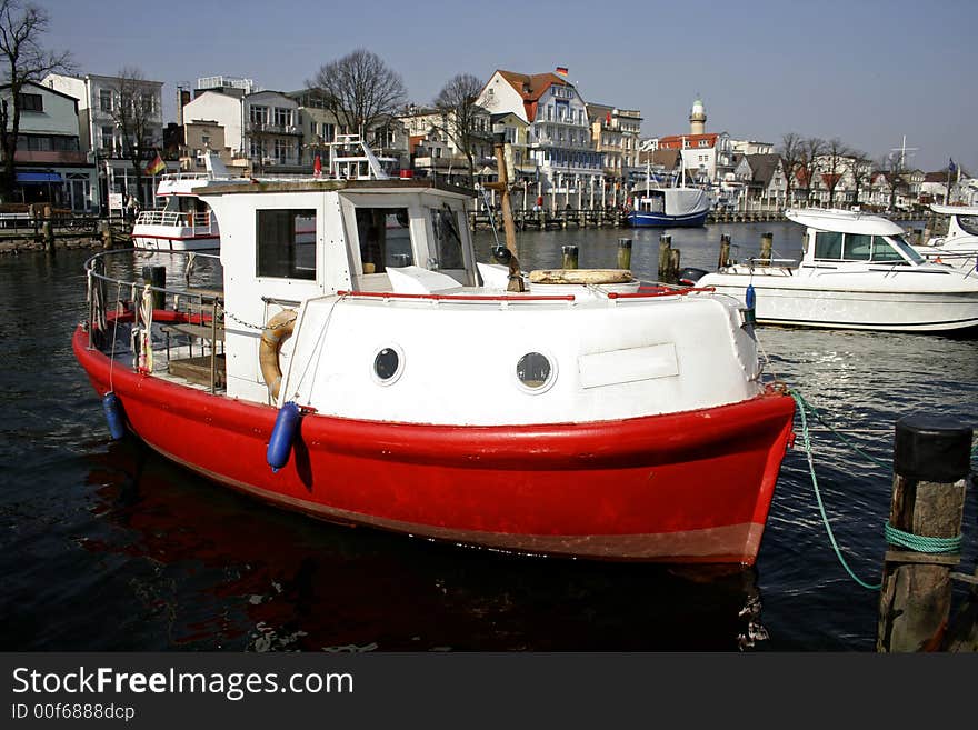 Red fishing boat in marina