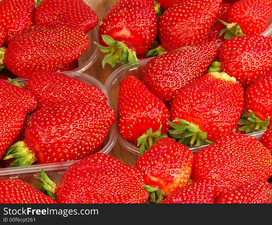 Close-up of baskets of strawberries for sale in a street market