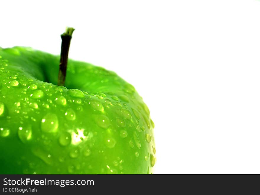 One Clouse-up macro green apple on the white background. One Clouse-up macro green apple on the white background.