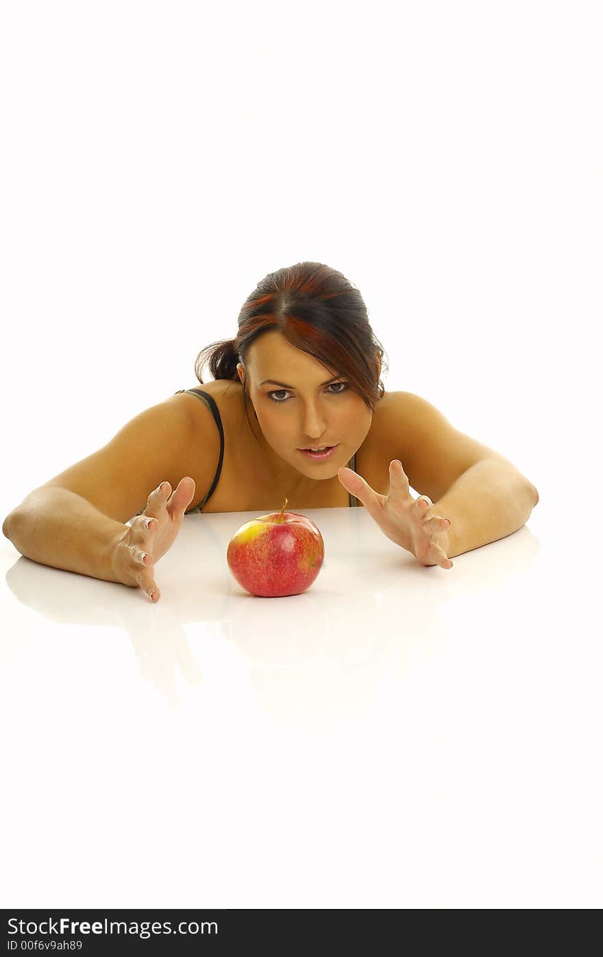 Woman exercising and red apple