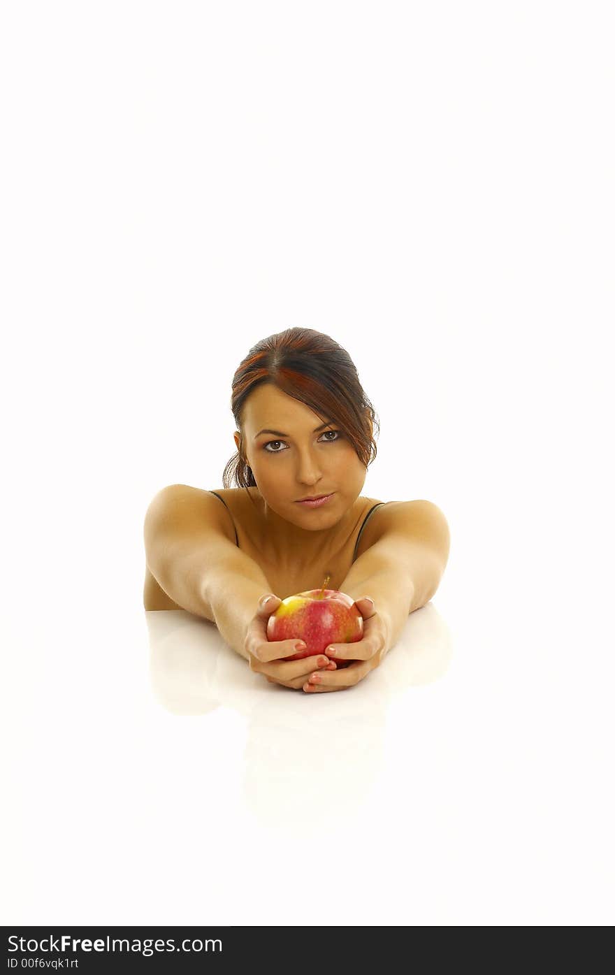 Woman exercising and red apple