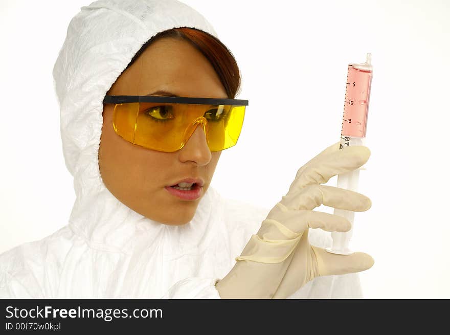 Beautiful female young scientist wearing glasses while doing a blood test. Beautiful female young scientist wearing glasses while doing a blood test