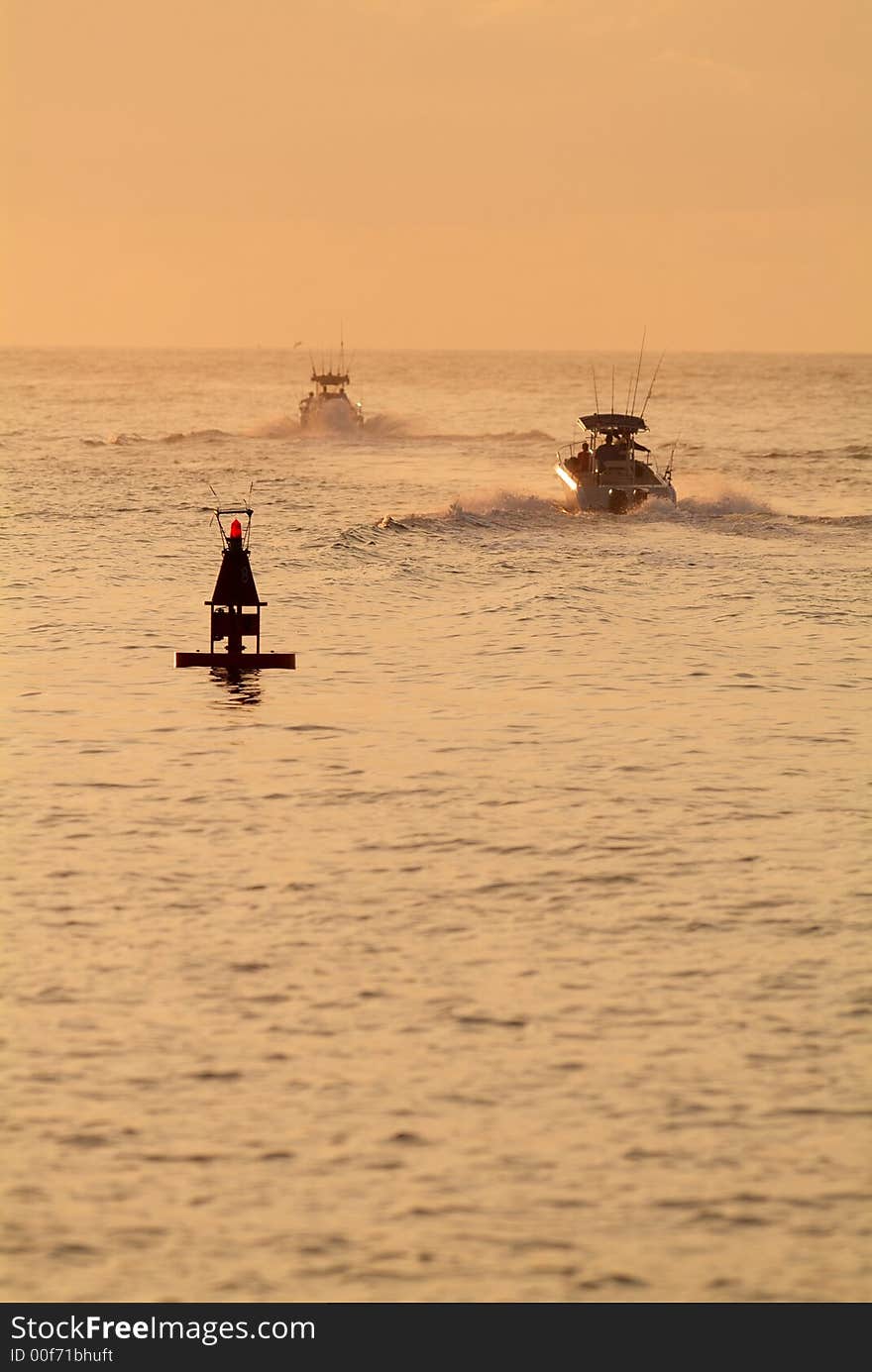 Boats heading out in the early morning to the fishing grounds. Boats heading out in the early morning to the fishing grounds.