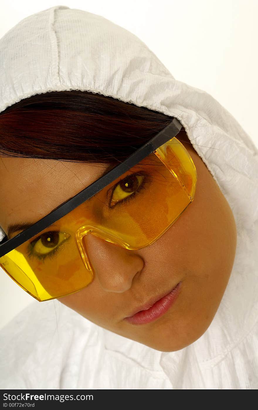 Beautiful female young scientist wearing glasses while doing a blood test. Beautiful female young scientist wearing glasses while doing a blood test