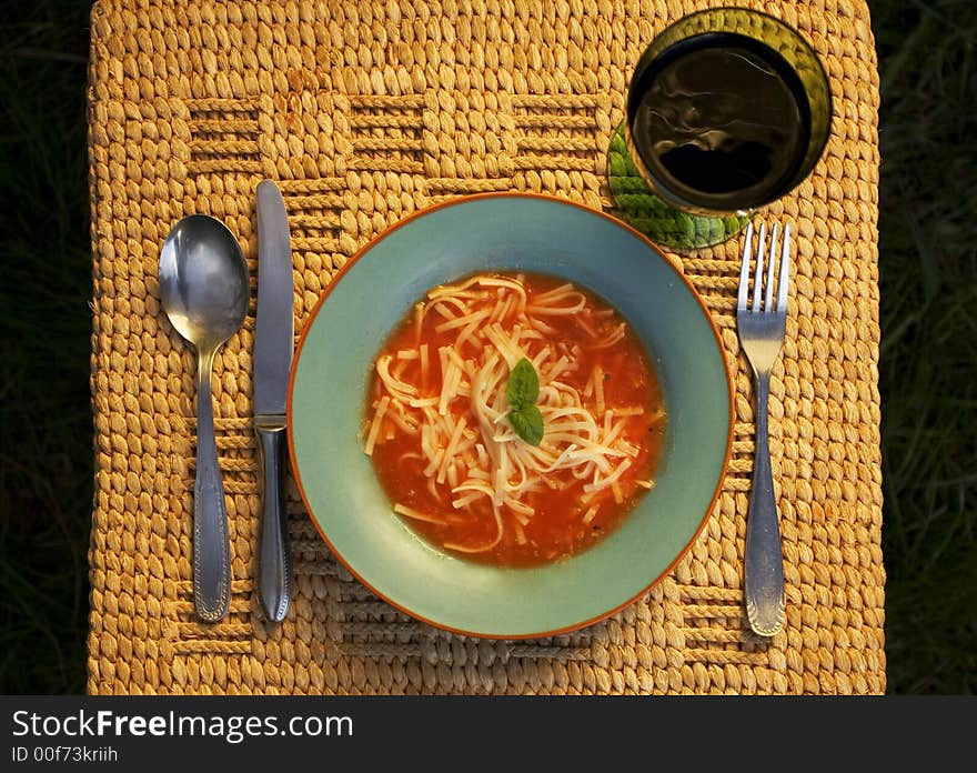 Bowl of tomato Soup with glass of vine