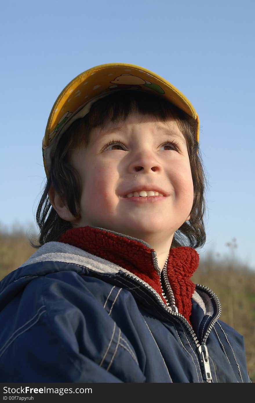 The little boy in the yellow cap. The little boy in the yellow cap