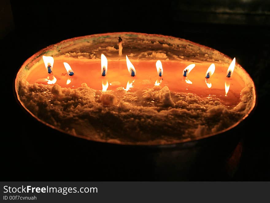 Candles in a pot of yak butter. Tibet. China. Candles in a pot of yak butter. Tibet. China