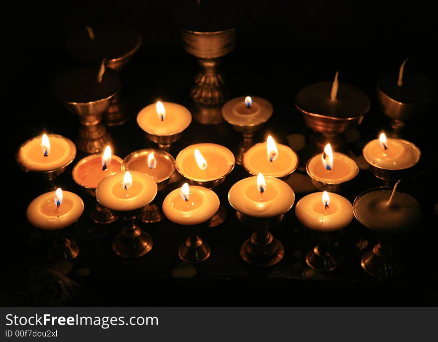 Rows of candles in a temple. Rows of candles in a temple.