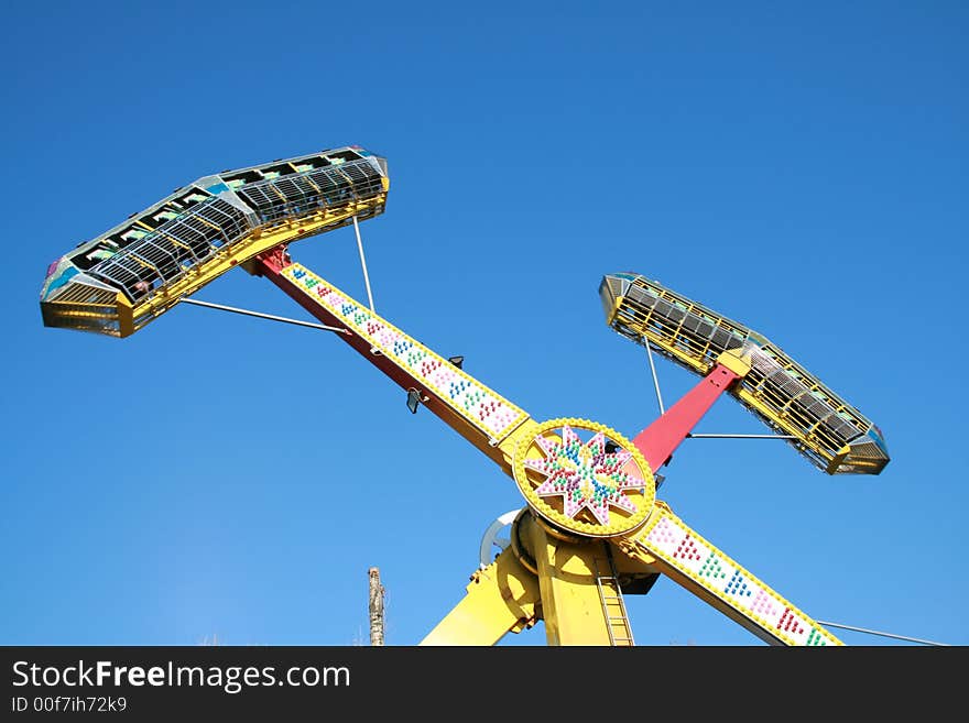 An extreme roundabout on a background of the blue sky