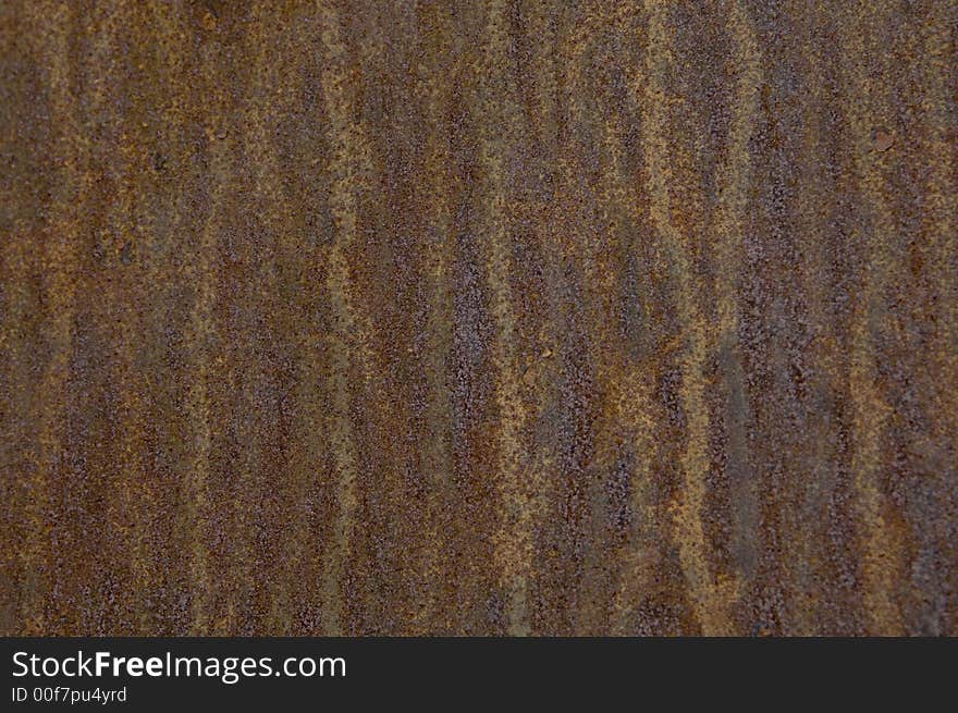 Rusty wall background with lots of texture and varied color