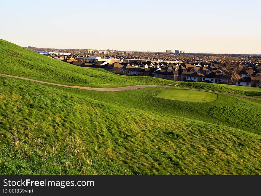 Photo of green golf course with beutiful clouds background. Photo of green golf course with beutiful clouds background