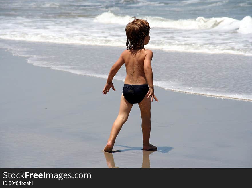 Portrait of a young boy playing on the beach. Portrait of a young boy playing on the beach