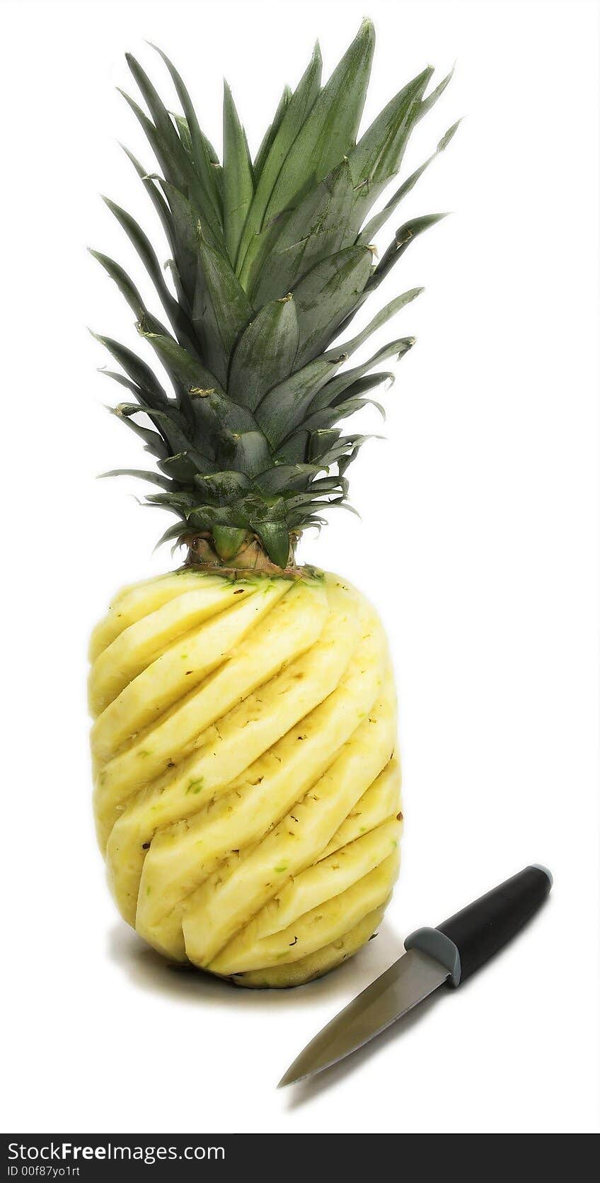 Pineapple with knife