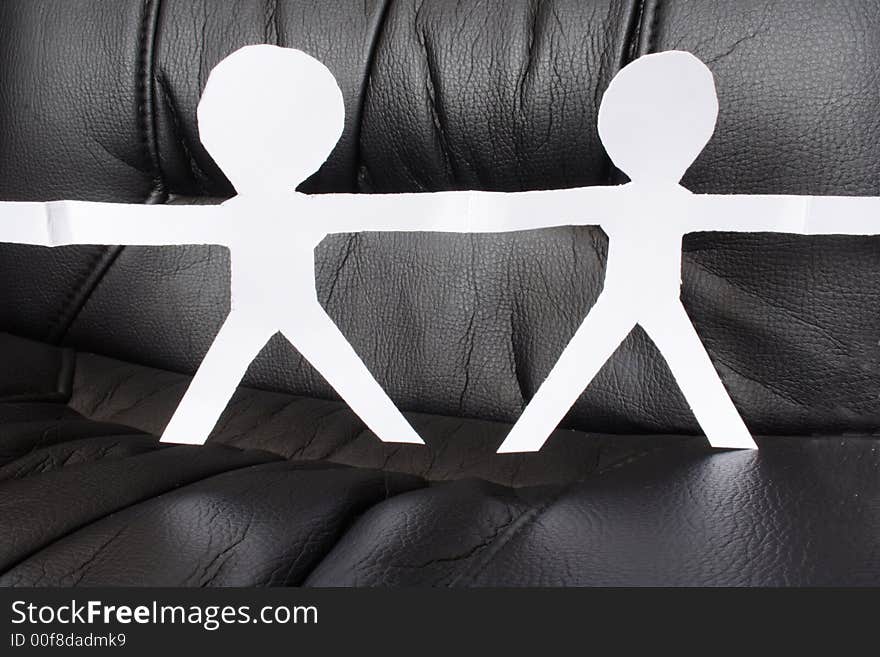 Two paper figures with black background. Two paper figures with black background