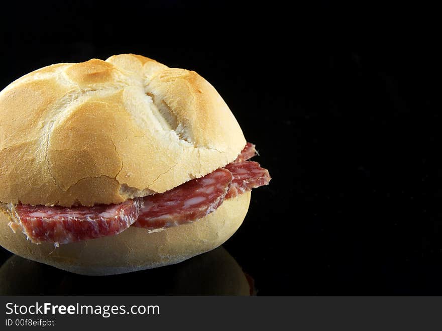 Salami slice in a bread sandwich. Salami slice in a bread sandwich