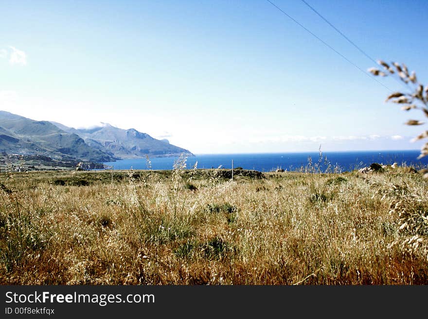 Beautiful view. Countryside, mounts and Mediterranean coast of Scopello. Castellammare del Golfo. Sicily. Italy. Beautiful view. Countryside, mounts and Mediterranean coast of Scopello. Castellammare del Golfo. Sicily. Italy