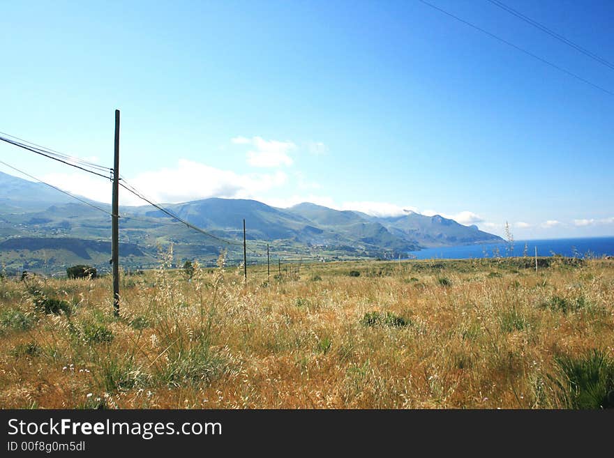 Beautiful view. Countryside, mounts and Mediterranean coast. Scopello. Sicily. Italy. Beautiful view. Countryside, mounts and Mediterranean coast. Scopello. Sicily. Italy