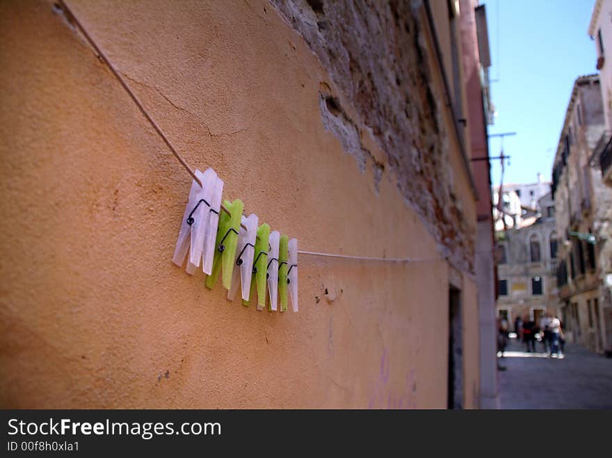 Clothes pegs hanging on a washing line. Clothes pegs hanging on a washing line