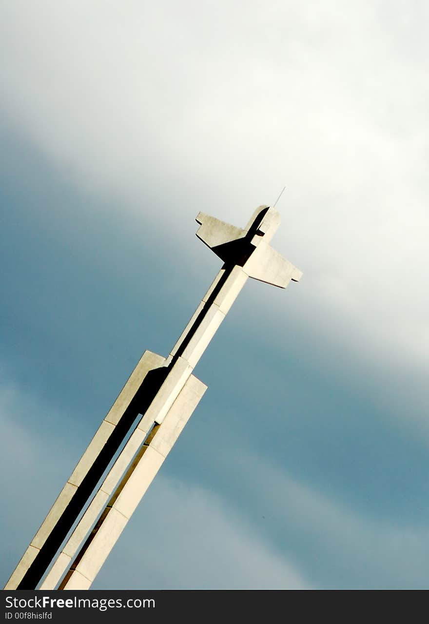 A cross against cloudy sky