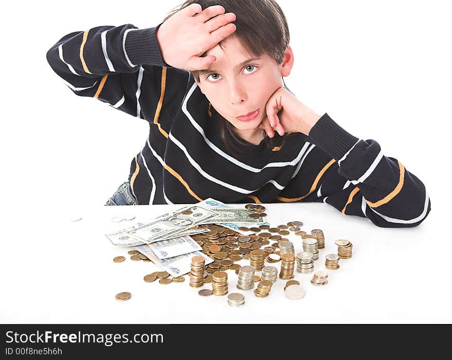 Boy considers money in piggy bank