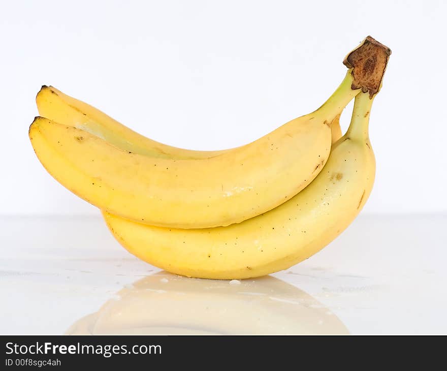 Bunch of bananas on glass table