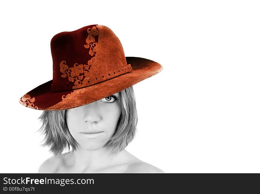 A young beautiful woman with blue eyes is wearing a cowboy hat - stetson. A young beautiful woman with blue eyes is wearing a cowboy hat - stetson