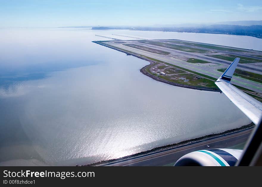 Jet leaving San Francisco international Airport, looking south over the bay. Jet leaving San Francisco international Airport, looking south over the bay