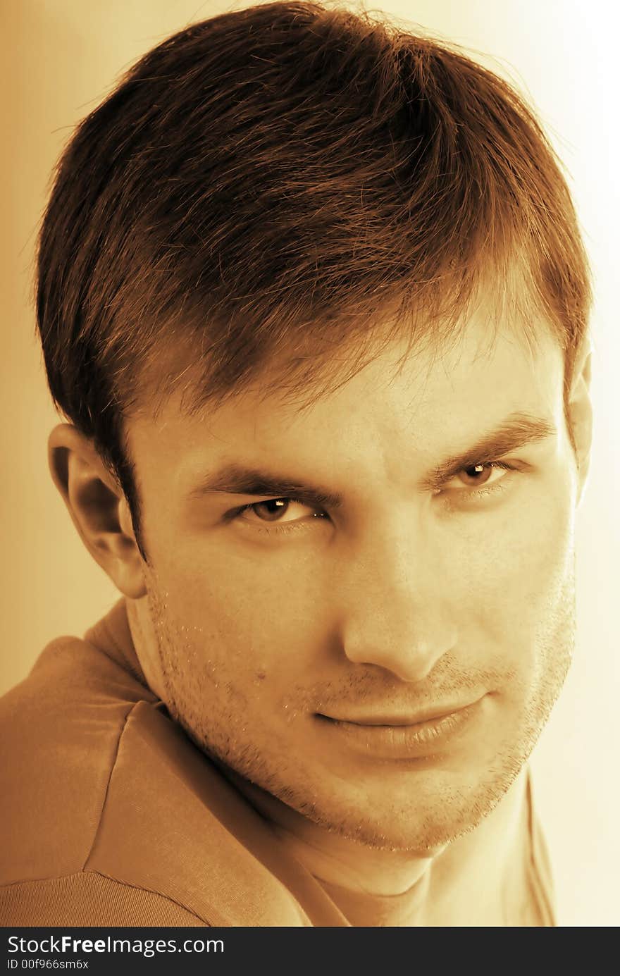 Portrait of young guy which looks in an objective on white background. Portrait of young guy which looks in an objective on white background