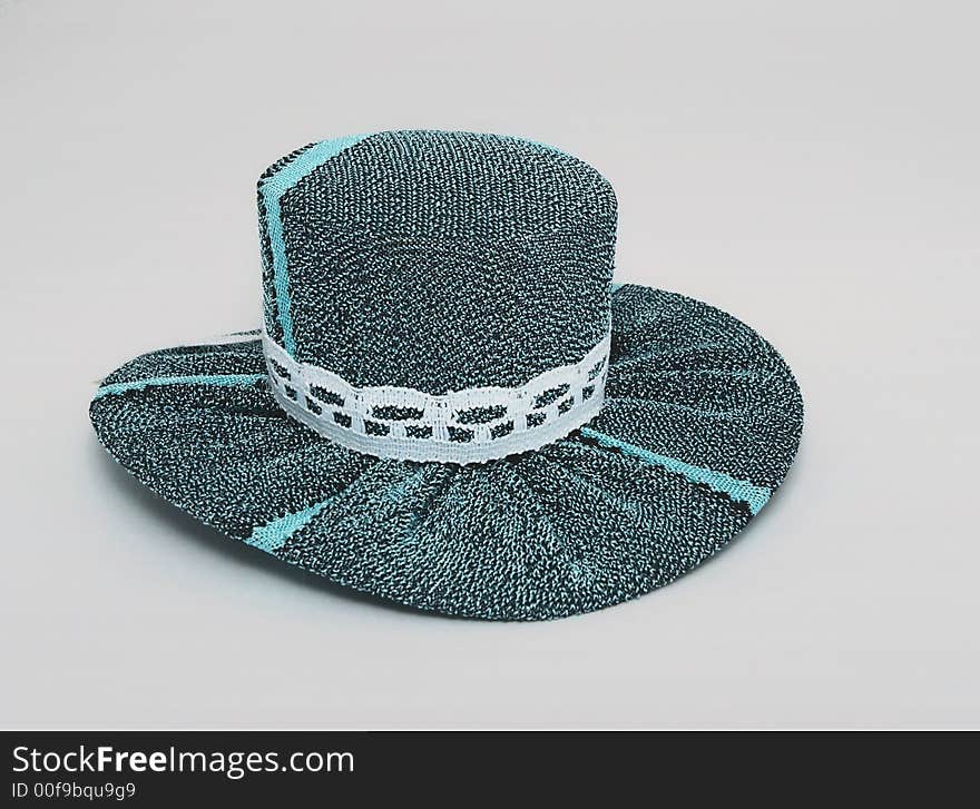 Hat for a doll on a homogeneous background