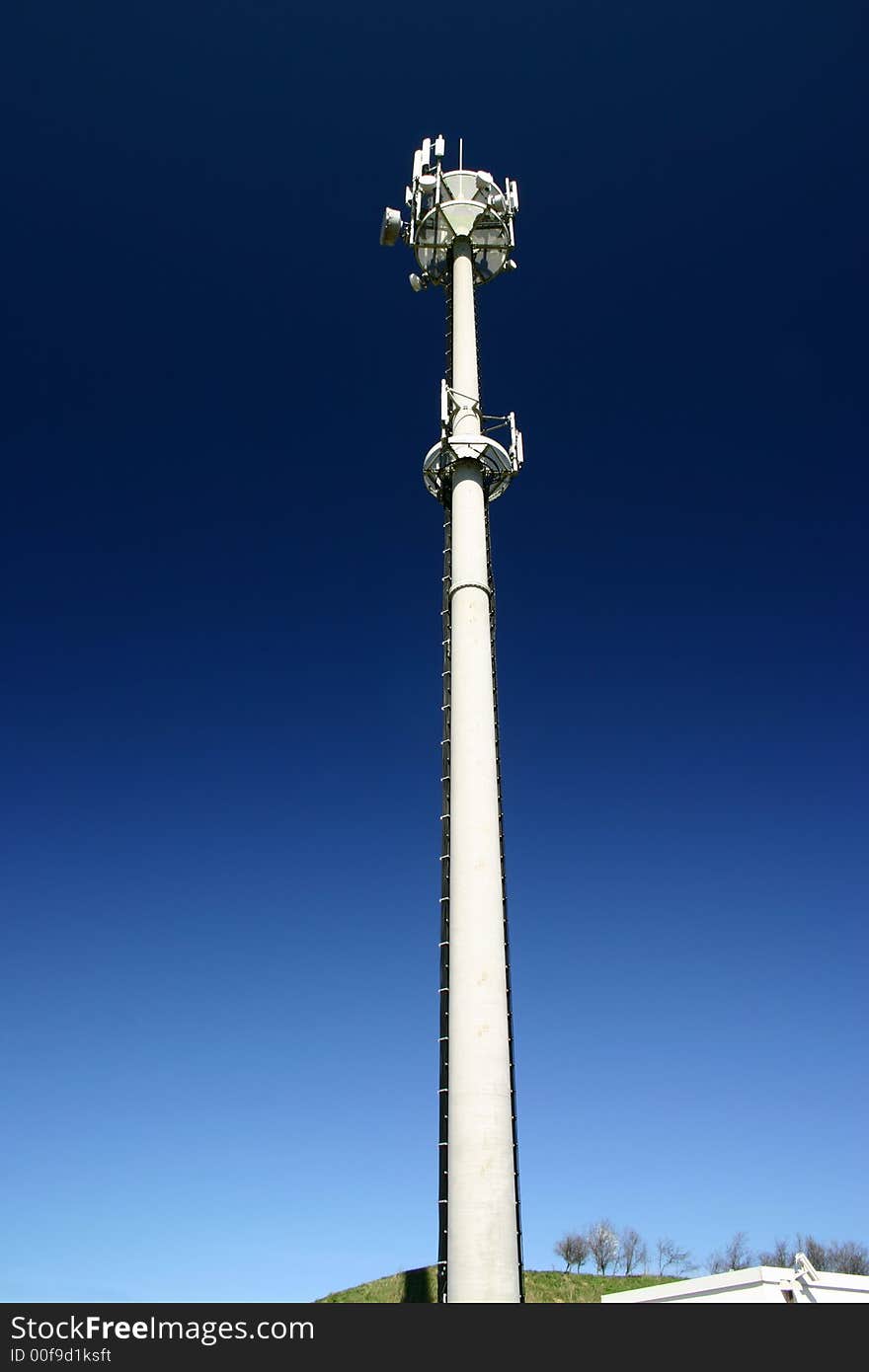 Cell phones relay tower on a clean blue sky. Cell phones relay tower on a clean blue sky