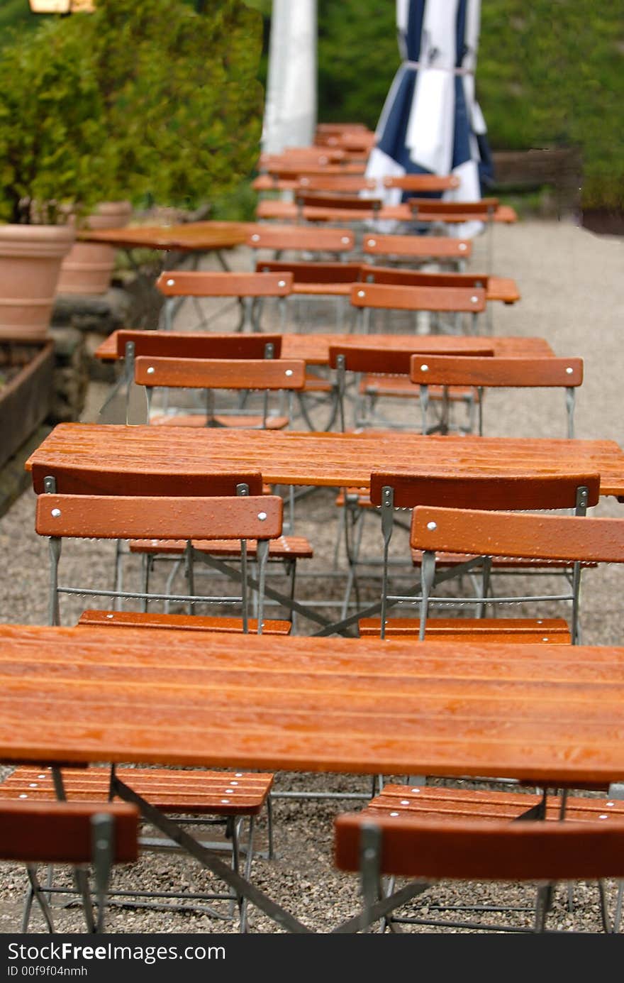 Cafe outdoor tables after the rain. South Bavaria. Cafe outdoor tables after the rain. South Bavaria