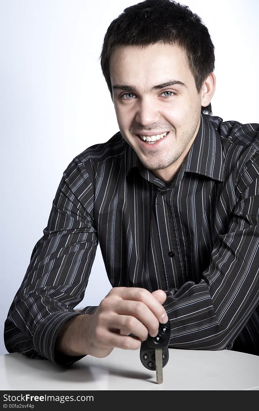 Smiling young man with car keys. Smiling young man with car keys