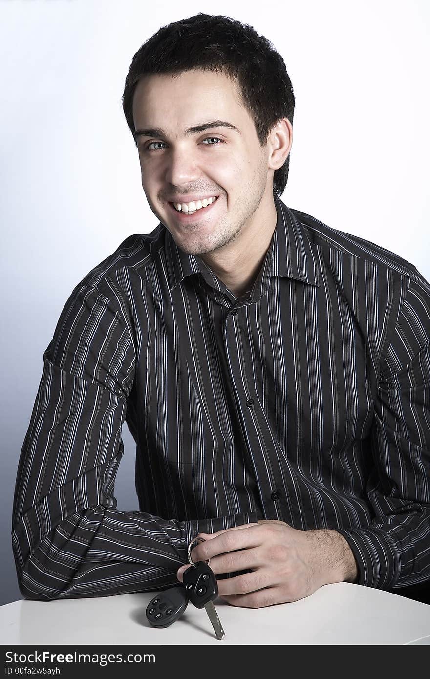 Smiling young man with car keys. Smiling young man with car keys