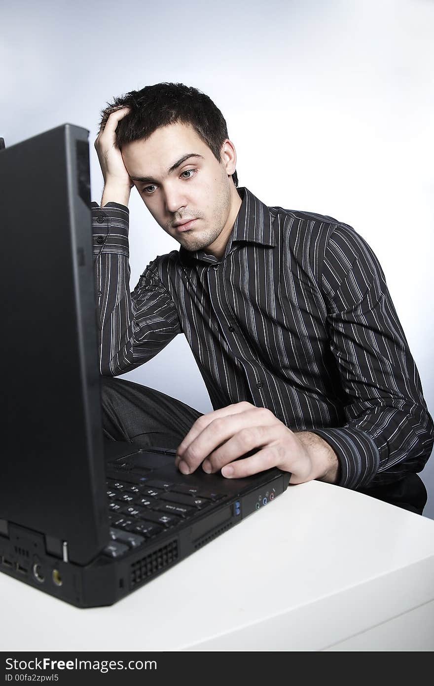 Serious young man with notebook. Serious young man with notebook