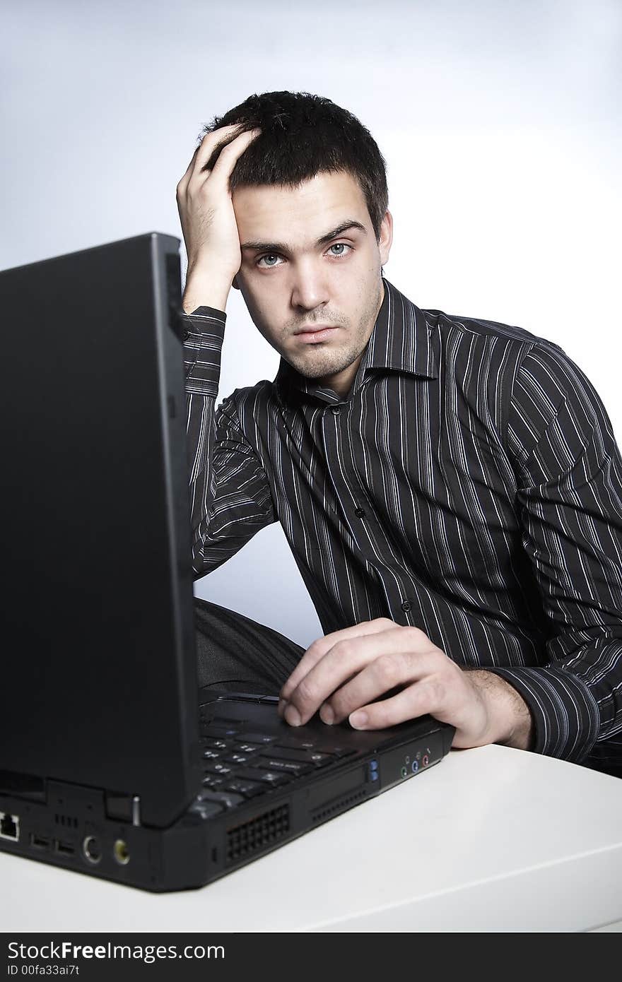 Serious young man with notebook. Serious young man with notebook