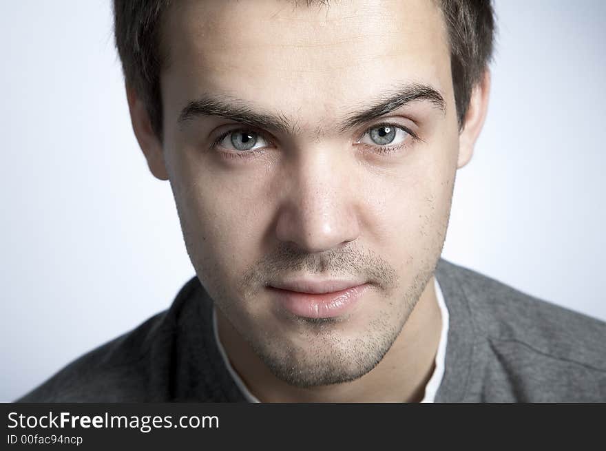 Smiling attractive young man on plain background. Smiling attractive young man on plain background