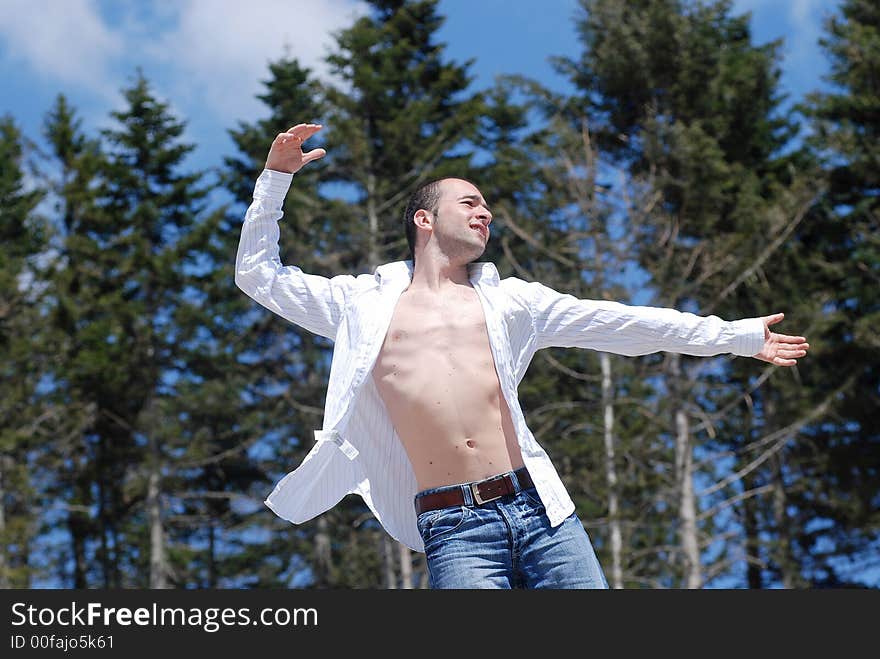 Man posing on the top of the hill