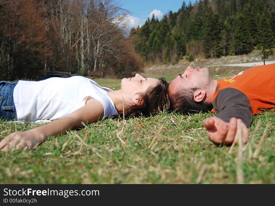 Young couple liying on grass. Young couple liying on grass