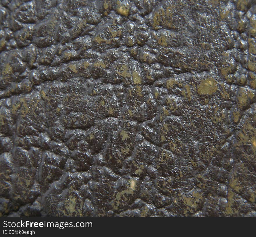 Macro shot of an old leather book cover.