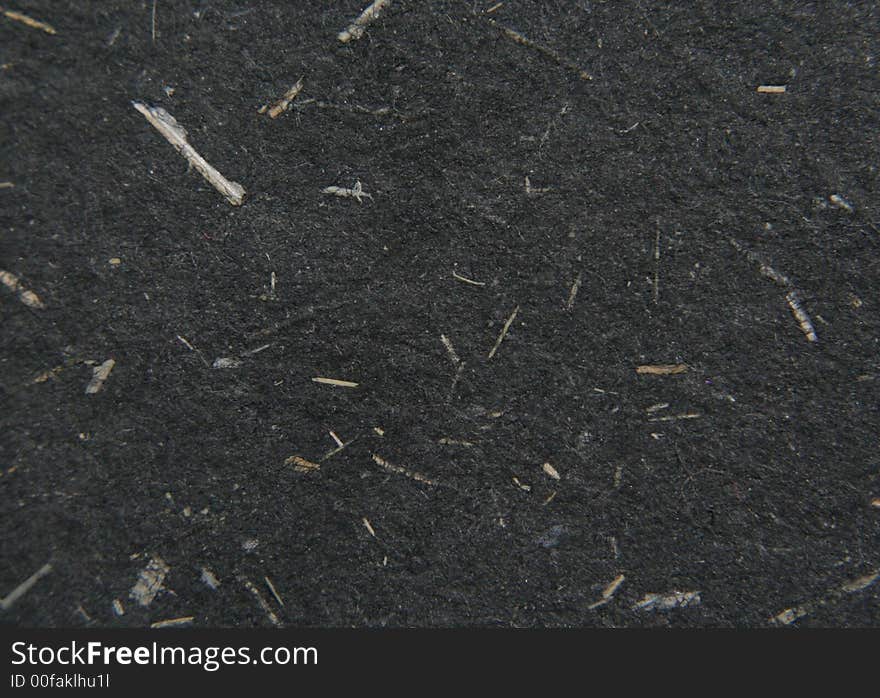 Macro shot of black textured paper. You can see rough fibers and lines on it. Macro shot of black textured paper. You can see rough fibers and lines on it.