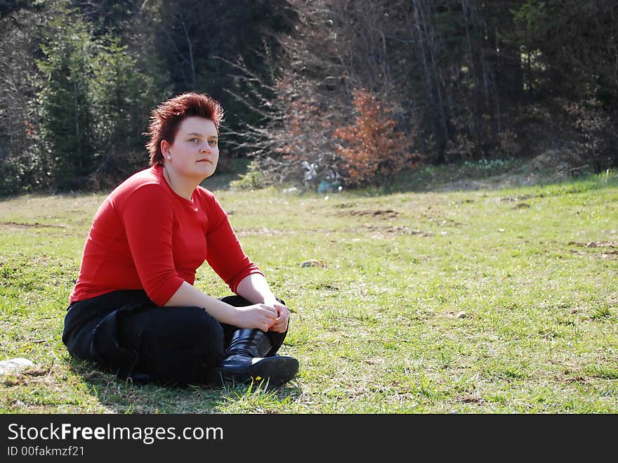 Young lady posing on grass. Young lady posing on grass