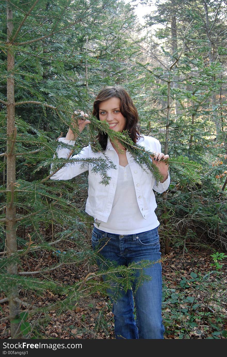 Beautiful young woman posing in forest. Beautiful young woman posing in forest