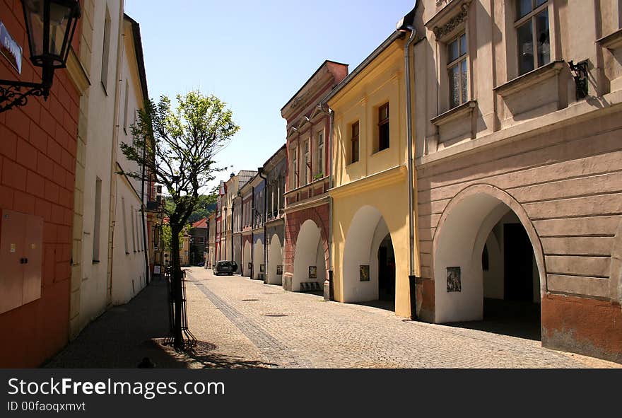 Old terrace houses with archway in a spring sunshine. Old terrace houses with archway in a spring sunshine