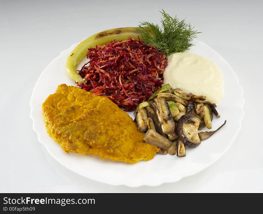 Fried chicken fillet with beet,zucchini and smashed potatoes