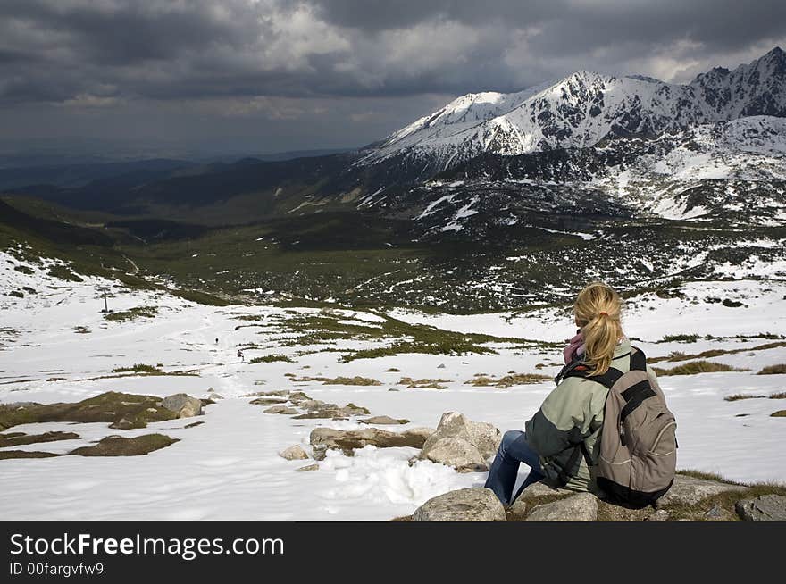 Girl watching the view high in the mountains. Picture taken in Poland