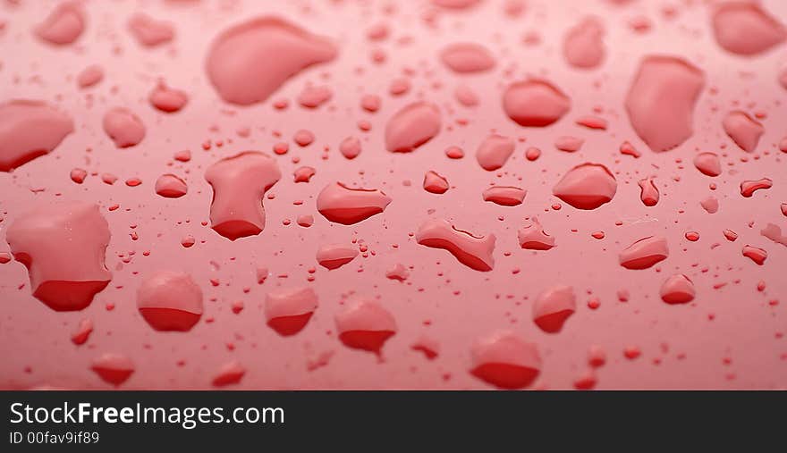 Rain Drops On The Red Surface