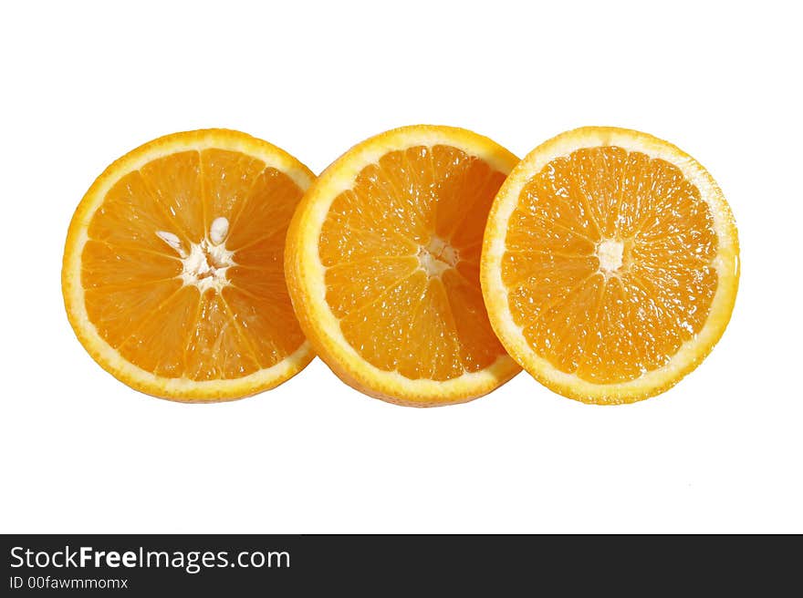 The inside of three juicy oranges