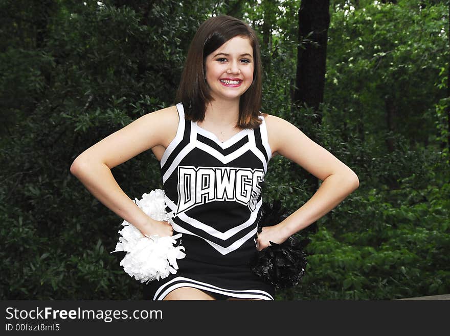 Girl cheering getting ready to cheer for her team. Girl cheering getting ready to cheer for her team.